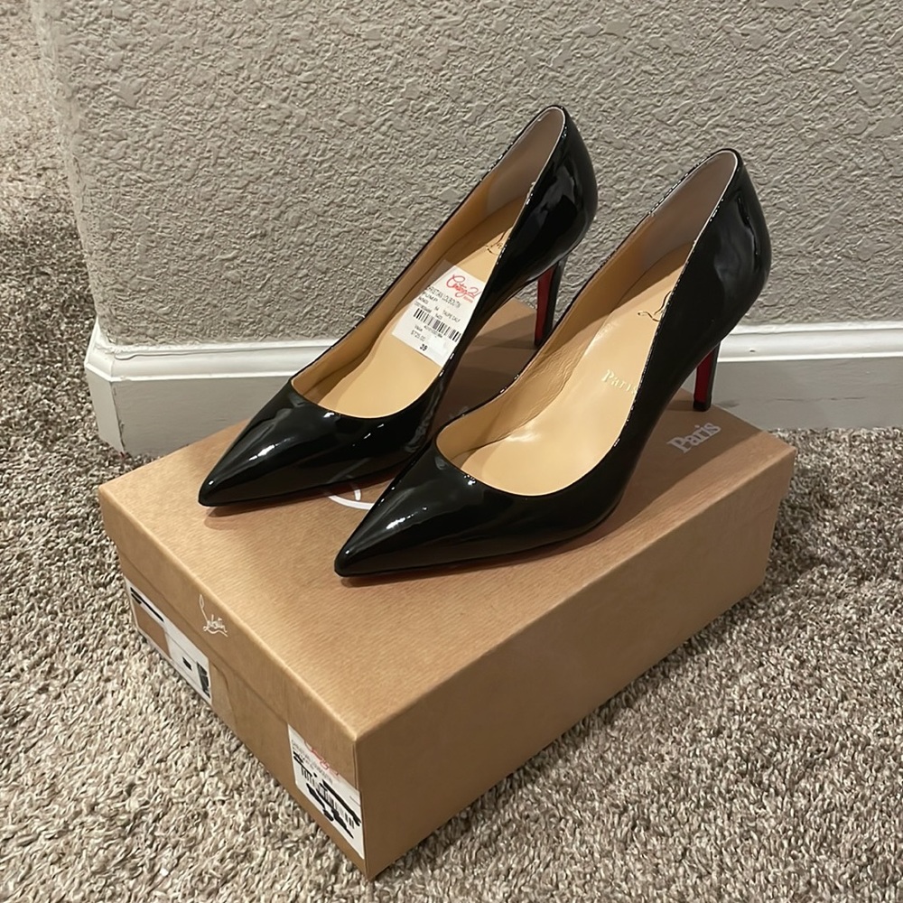 Authentic Christian Louboutin Kate heels in black. Red bottoms. Retails $795